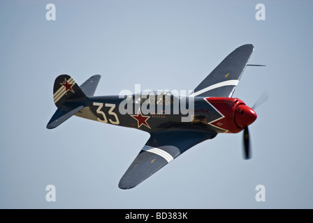 A YAK3U, the 'Steadfast' performs at an air show.  This is not a historic aircraft, but a modern built continuation model. Stock Photo