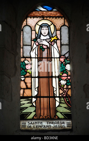 Stained glass window of Sainte Thérèse in the church of Saint-Genest de Lavardin, Loir et Cher, Centre, France (editorial only). Stock Photo