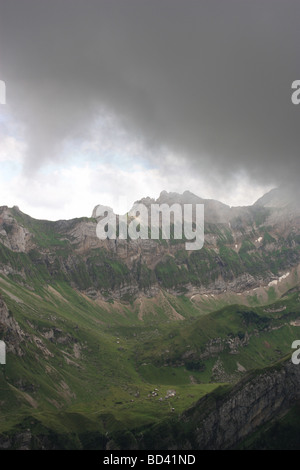 Storm coming up in rocky alpine setting, providing a spectacular scenery. Stock Photo