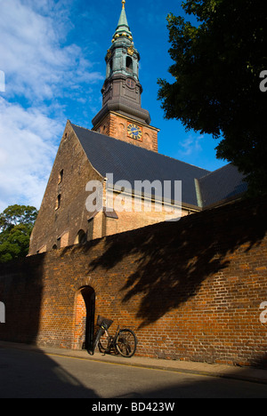 Bicycle parked in front of St Petri church in central Copenhagen Denmark Europe Stock Photo