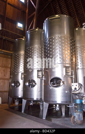 Large steel industrial vats or containers for gas or chemicals, with ...