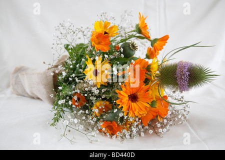 bridal bouquet; marigold (Calendula officinalis) and teasel (Dipsacus fullonum) Stock Photo