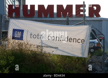 A General Motors “Total Confidence” banner hangs in front of a suburban Maryland Hummer dealership. Stock Photo