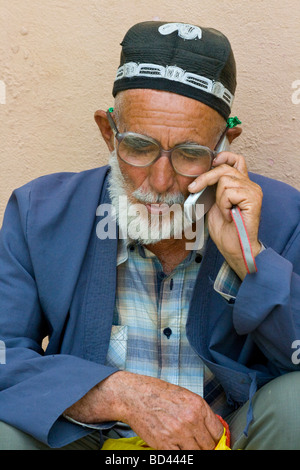 Uzbek Man talking on a Mobile Phone in Dushanbe Tajikistan Stock Photo