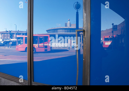 Buses at Southgate tube station, photographed in a reflection of a shop window Stock Photo