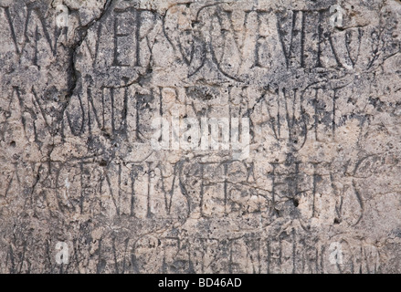 Roman engraved writing on ancient weathered stone Stock Photo