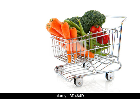 shopping cart with fresh vegetables isolated over white Stock Photo