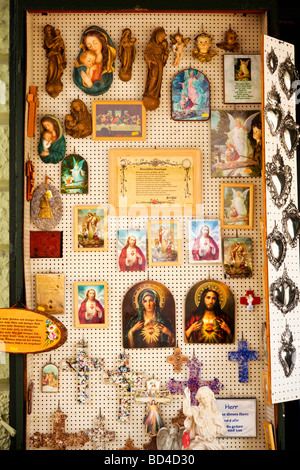 Religious icons and art in a gift shop window in Altötting Bavaria Germany Europe Stock Photo