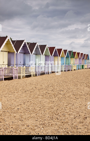 Row of pastel coloured beach huts, Mersea Island, Essex, UK