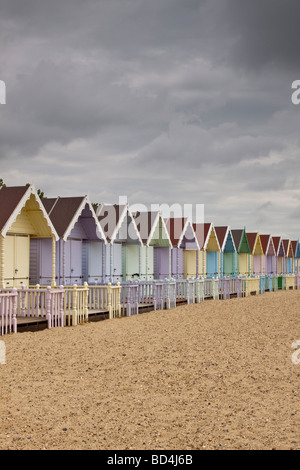 Row of pastel coloured beach huts, Mersea Island, Essex, UK