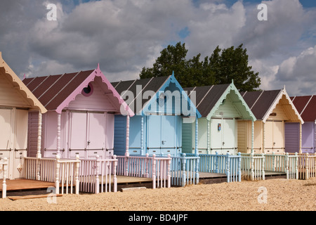Row of pastel coloured beach huts, Mersea Island, Essex, UK