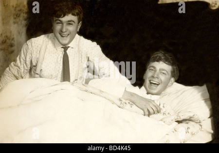 Two Men Having Fun in Bed Stock Photo