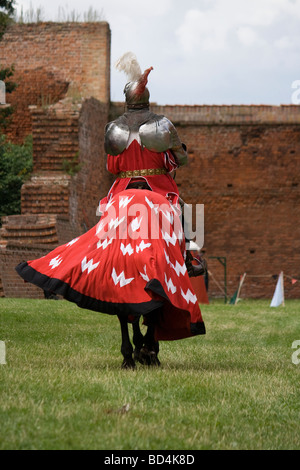 Back of proud medieval cavalry knight on military horse. Taken in Malbork, Poland, 2009. Stock Photo