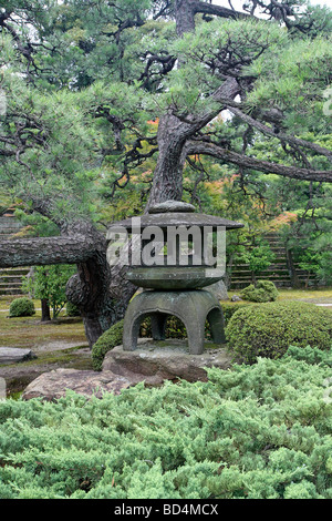 Stone lantern in a Japanese garden at Nijo castle. Kyoto. Kansai. Japan Stock Photo