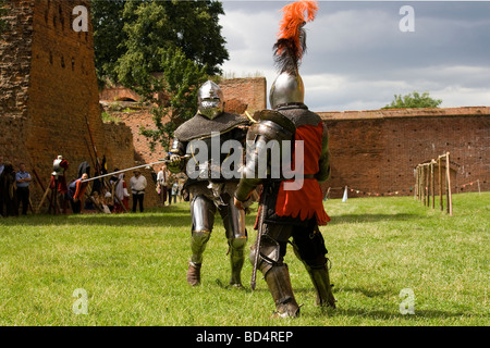 Medieval knights fighting with armor, swords and shields in festival ...