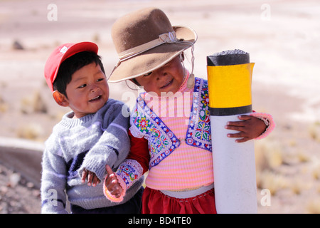 traditionally dressed children at the roadside near Arequipa Stock Photo