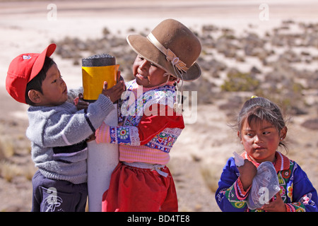 traditionally dressed children at the roadside near Arequipa Stock Photo