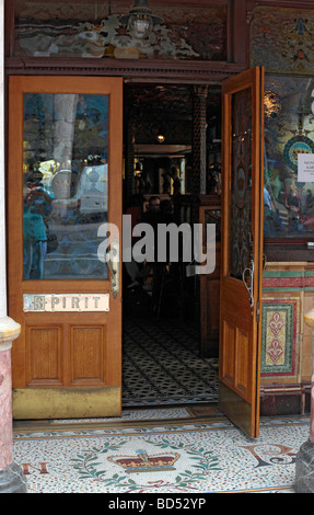 Entrance to the Crown Liquor Saloon in central Belfast, showing the eponymous mosaic crown on the ground just outside the doors Stock Photo