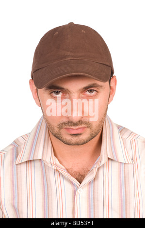 Man wearing a baseball cap staring at camera against a white background Stock Photo