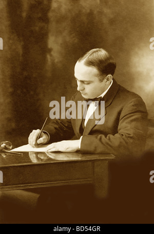 Man Writing a Letter with a Dip Pen Stock Photo