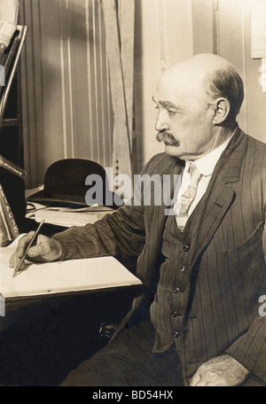 Bald Man in Striped Suit Working in Office Stock Photo