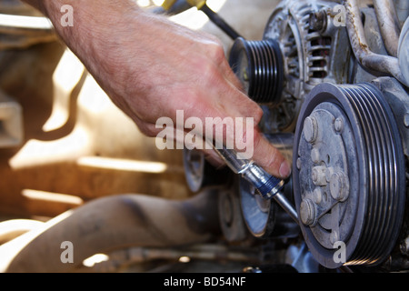Man working on Dodge engine Stock Photo