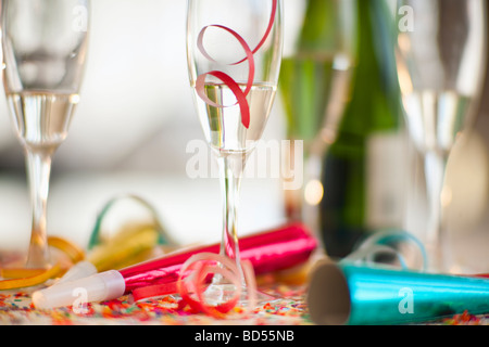 Champagne bottle and party supplies Stock Photo
