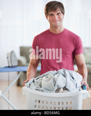 Man doing laundry Stock Photo
