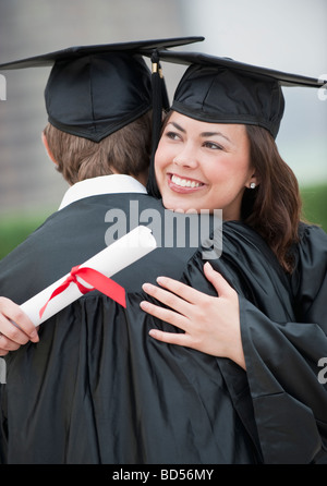 A young woman and young man graduating Stock Photo