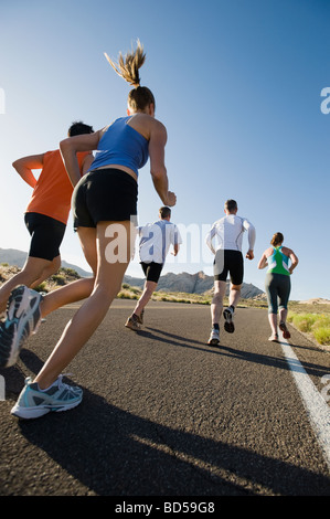 Runners on a road Stock Photo