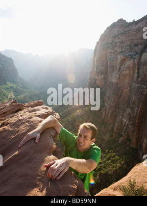 A man climbing up a rock at Red Rock Stock Photo