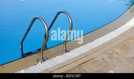 Swimming pool with entry ladder Stock Photo