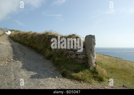 A track leads to cottages in the far west of Cornwall Stock Photo