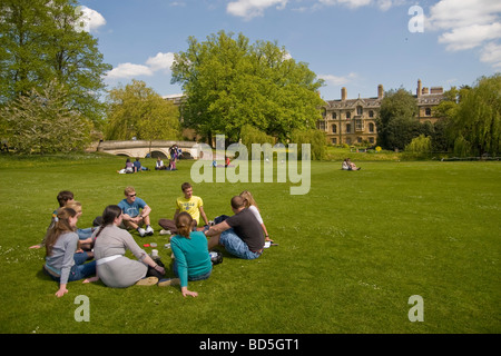 Cambridge university Students Chatting, relaxing sitting in a group Stock Photo