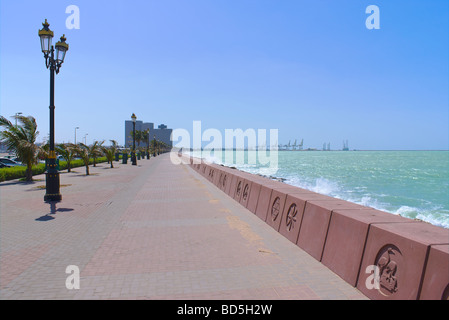 View along the Deira Corniche Sidewalk, Deira, Dubai, United Arab Emirates (UAE), to the Hyatt Regency hotel and the port area Stock Photo