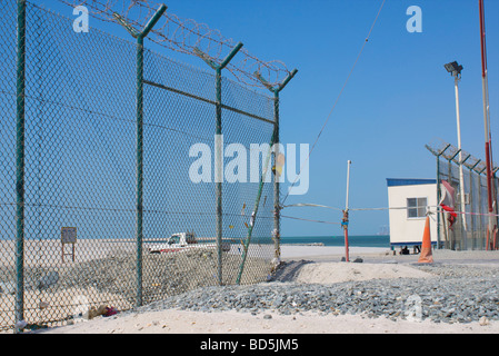 Guarded gate to the Palm Deira Corniche and Palm Deira construction area, Deira, Dubai. See description for further info. Stock Photo