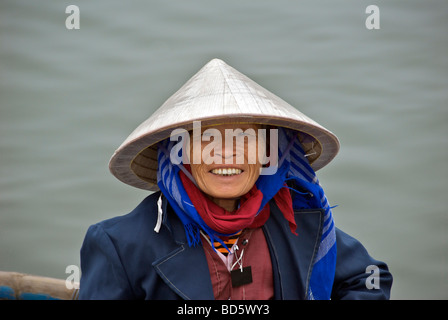 Portrait smiling boat woman wearing conical hat Tam Coc Lake Ninh Binh Province Northern Vietnam Stock Photo