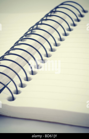 Close up of a notepad's spiral binder Stock Photo