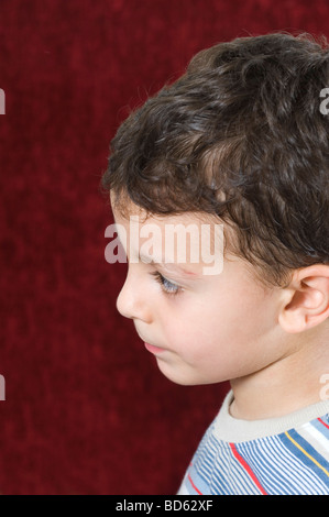 Profile of a young boy looking away Stock Photo