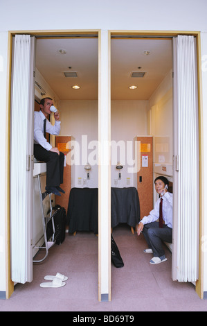 Businessmen sitting in hotel Stock Photo