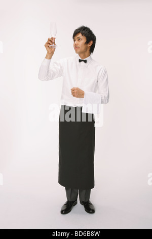 Young man observing empty glass Stock Photo