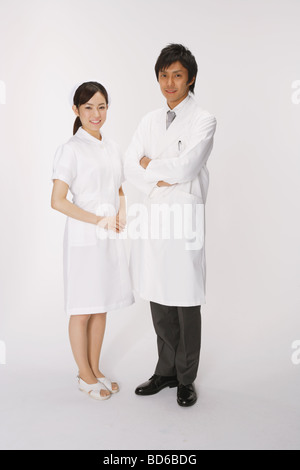 Nurse and doctor standing together Stock Photo