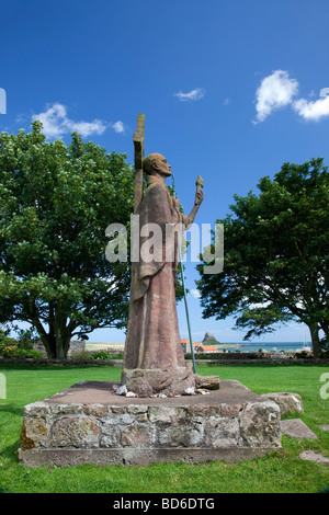 Saint Aidan's statue in the grounds of St Mary's Church, Lindisfarne, Holy Island, Northumberland. UK, EUROPE Stock Photo