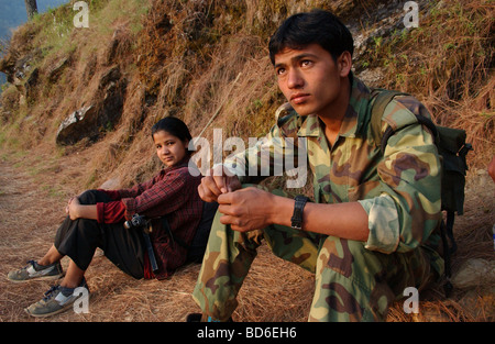 RUKUM DISTRICT NEPAL APRIL 21 2004 Maoist insurgents walk through the mountains to a mobile training camp in Rukum district Stock Photo