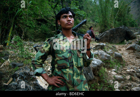 RUKUM DISTRICT NEPAL APRIL 21 2004 Maoist insurgents walk through the mountains to a mobile training camp in Rukum district Stock Photo