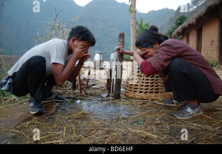 RUKUM DISTRICT NEPAL APRIL 21 2004 Maoist insurgents wash up before beginning their walk through the mountains to a mobile Stock Photo