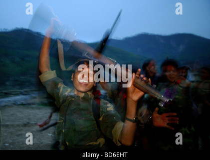 RUKUM DISTRICT NEPAL APRIL 22 2004 Maoist insurgents celebrate in Rukum district April 22 2004 weeks after their attack on Stock Photo