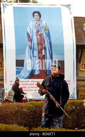 A soldier stands guard in front of a poster of Queen Komal as thousands of people arrive to celebrate Democracy Day and to Stock Photo