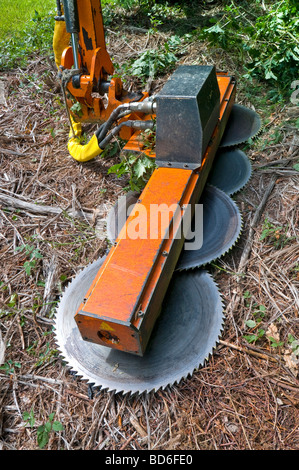 Tractor mounted 'Noremat' 4-bladed circular saw for cutting tree branches - France. Stock Photo