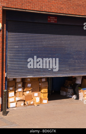 A shop store trade entrance to warehouse full of goods in boxes in Norwich Norfolk Uk Stock Photo